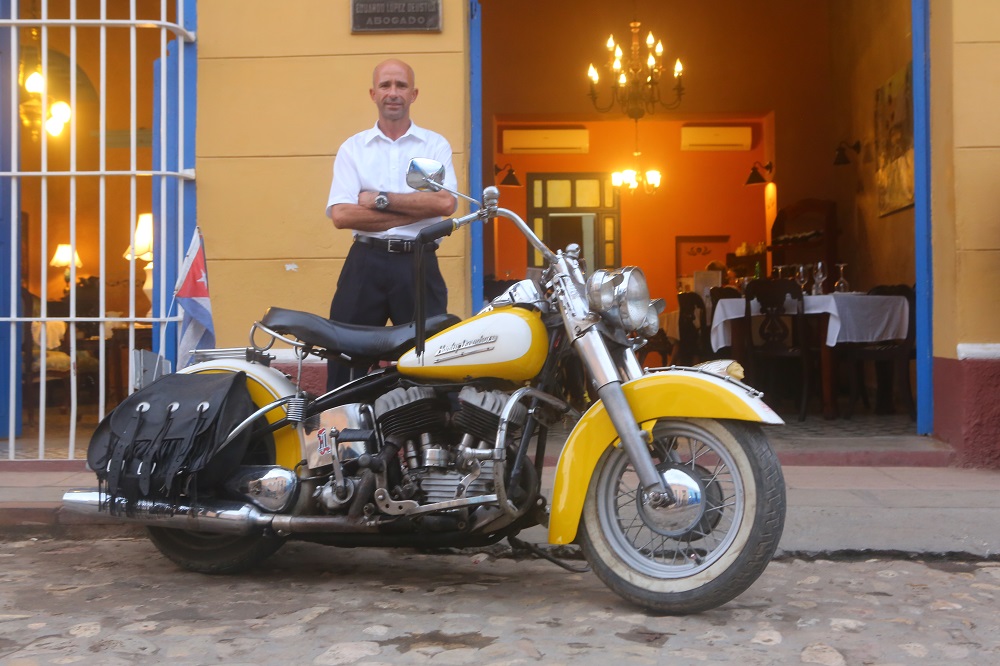 Leonys and his antique Harley-Davidson, Trinidad, Cuba; copyright Christopher P Baker
